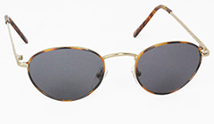 Guldfarvet oval solbrille med mørke glas